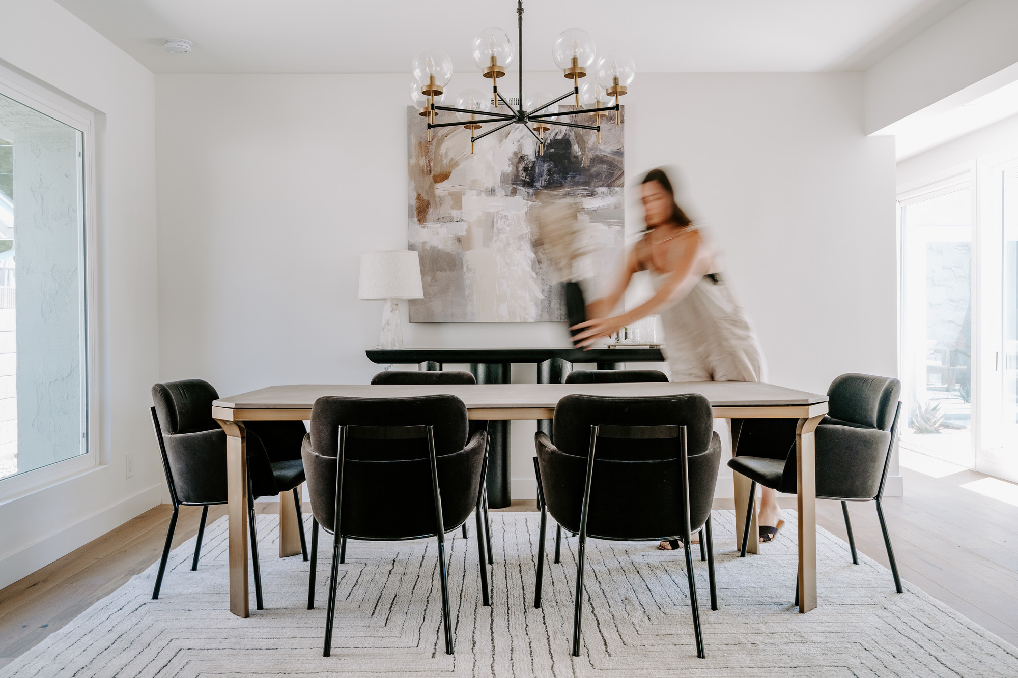 Designer styling a dining room with modern furniture